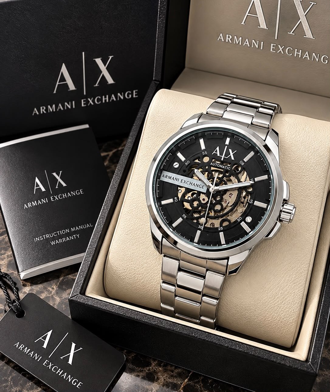 Armani Exchange Automatic Skeleton (Ref. AX2457 / AX2458) — Stainless Steel Case with Black Skeleton Dial, Open-Work Mechanical Movement, and Silver-Tone Steel Link Bracelet Hover