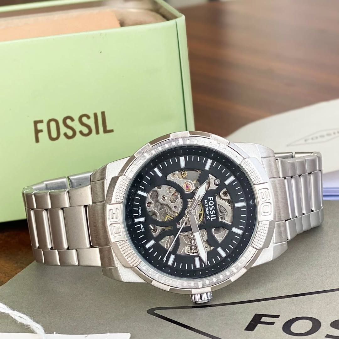 Fossil Automatic Skeleton Dial (Silver-Tone Stainless Steel Edition) — Silver Stainless Steel Case with Black Skeleton Dial, Open-Heart Movement, and Matching Link Bracelet Hover