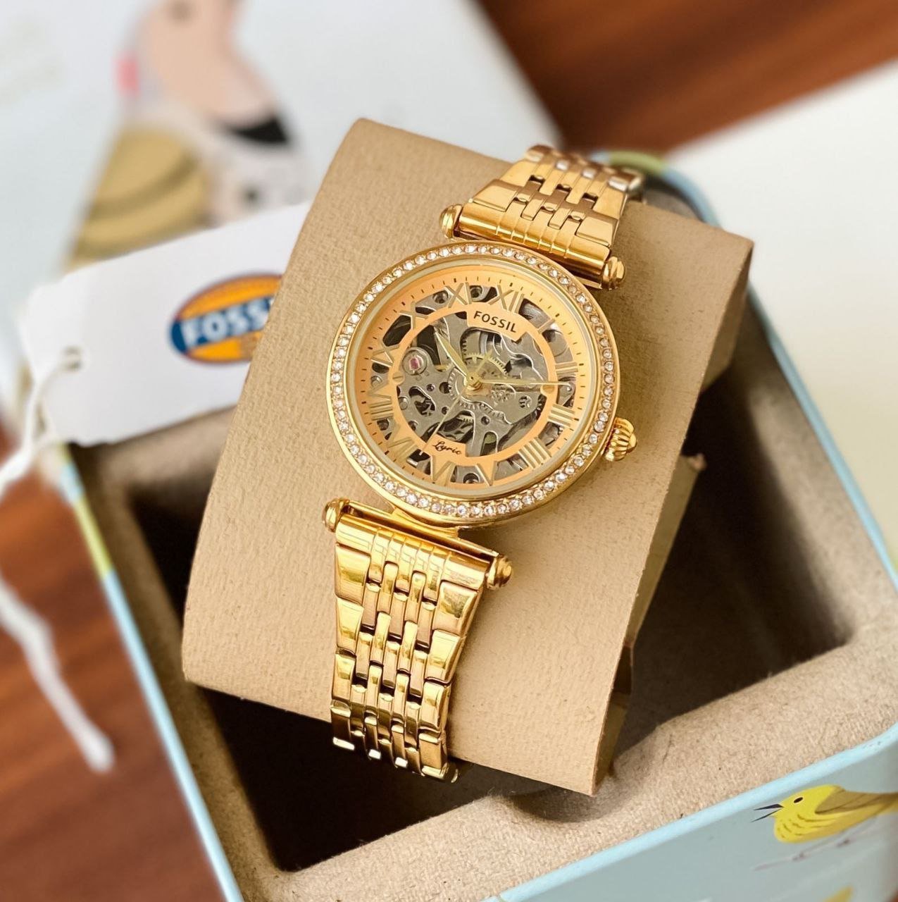 Fossil Lyric Automatic (Gold-Tone) — Rose Gold / Yellow Gold-Tone Stainless Steel Case with Skeleton Dial, Crystal Bezel, and Multi-Row Link Bracelet Hover