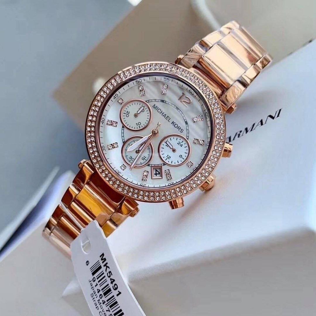 Michael Kors Parker Chronograph (Rose Gold-Tone and White Mother-of-Pearl Dial Edition, Ref. MK5491) — Rose Gold-Tone Stainless Steel Case with Crystal-Paved Bezel, White Dial, Chronograph Sub-Dials, Date Window, and Matching Link Bracelet Hover