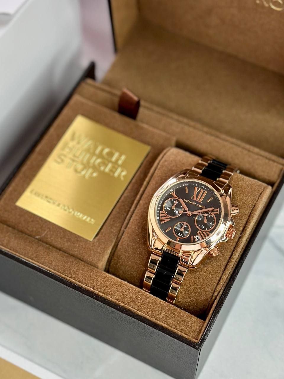 Michael Kors Lexington Chronograph — Rose Gold-Tone and Black Stainless Steel Case with Black Dial, Roman Numerals, Sub-Dials, and Two-Tone Bracelet Hover