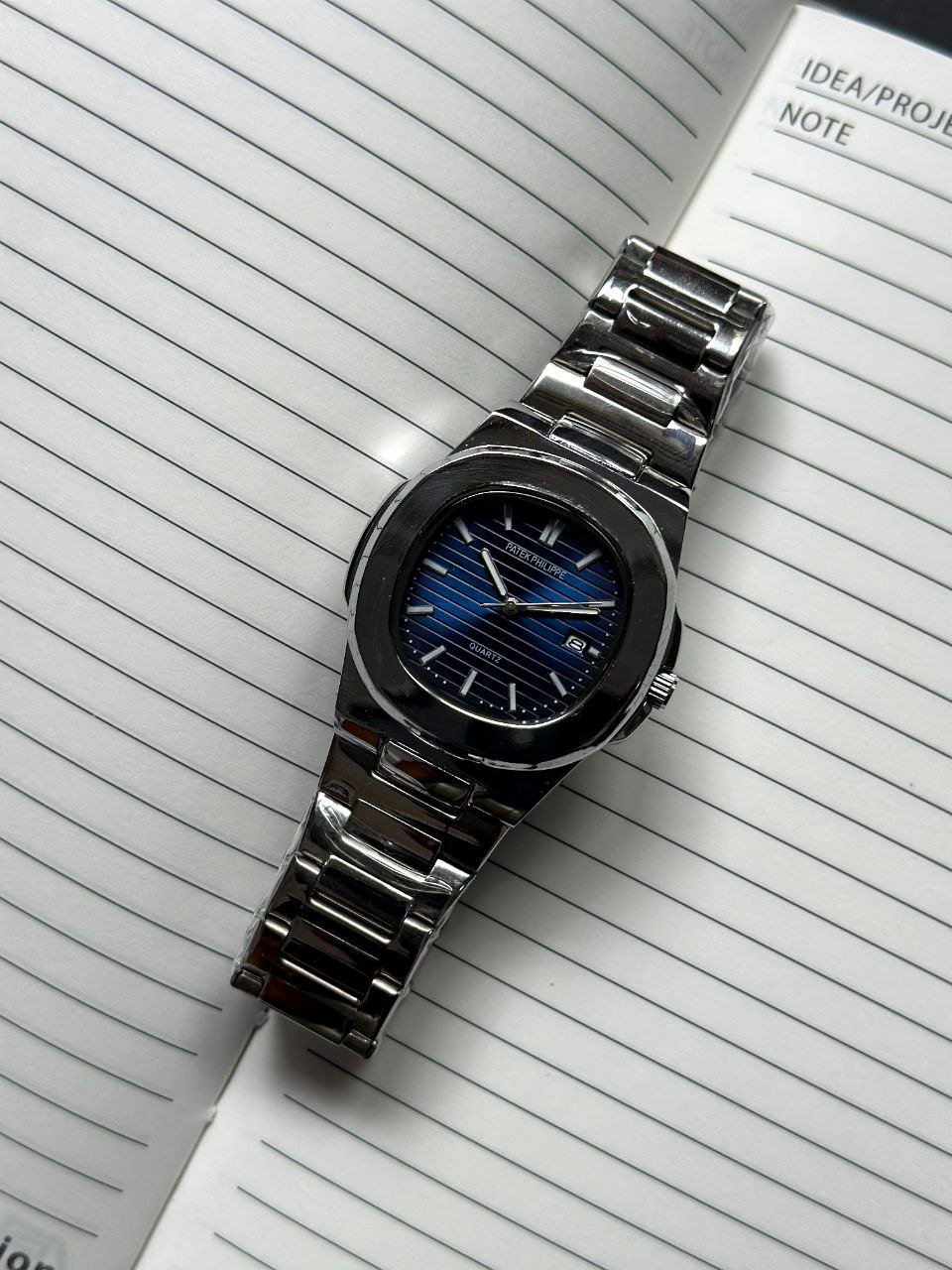 Patek Philippe Nautilus — Stainless Steel Case with Blue Gradient Dial, Horizontal Embossing, and Stainless Steel Bracelet Gallery