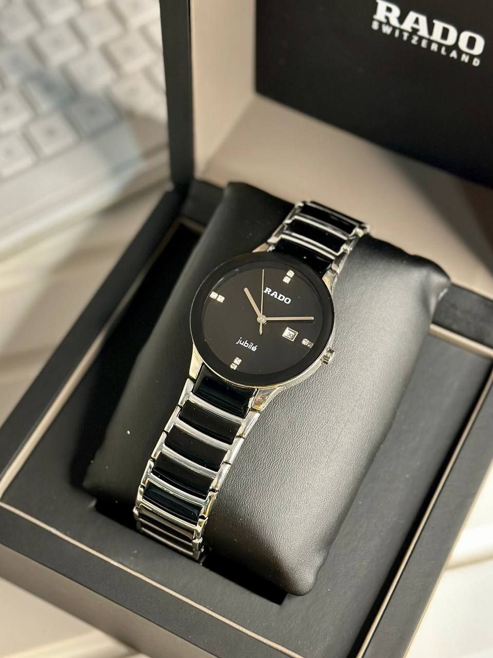 Rado Integral / Centrix Jubilé Black & Gold Edition (Black High-Tech Ceramic & Gold-Tone Case, Minimalist Glossy Black Dial with Diamond Hour Markers, Date Window, and Ceramic/Gold Link Bracelet) Hover