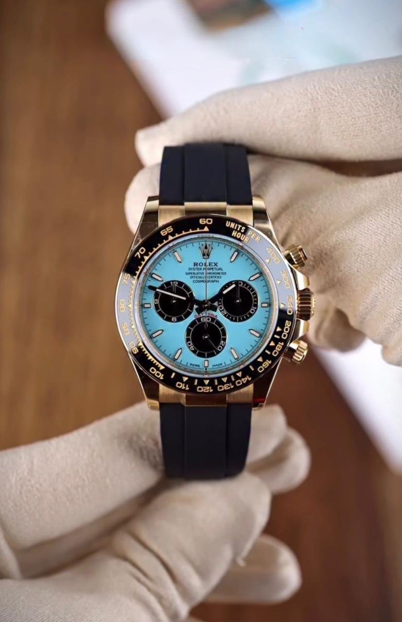 Rolex Cosmograph Daytona (18k Yellow Gold with Turquoise Lacquer Dial and Black Sub-Dials on Black Oysterflex Strap) Hover