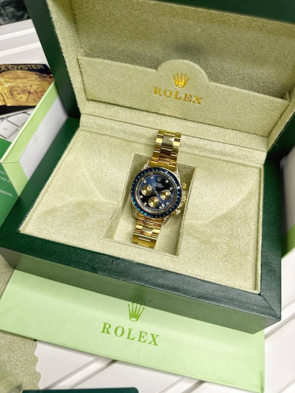 Rolex Cosmograph Daytona "Blue Sapphire & Diamond Edition" (Yellow Gold-Tone Case with Blue Sunburst Dial, Baguette-Cut Blue Sapphire Bezel, Diamond Hour Markers, Gold Sub-dials, and Oyster Link Bracelet) Hover