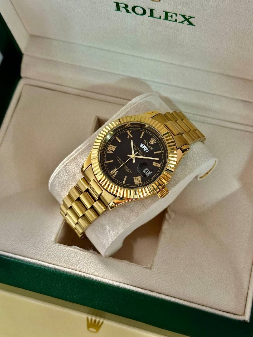 Rolex Oyster Perpetual Day-Date — 18 ct Yellow Gold Finish with Fluted Bezel, Black Roman Numeral Dial, and President Bracelet Hover