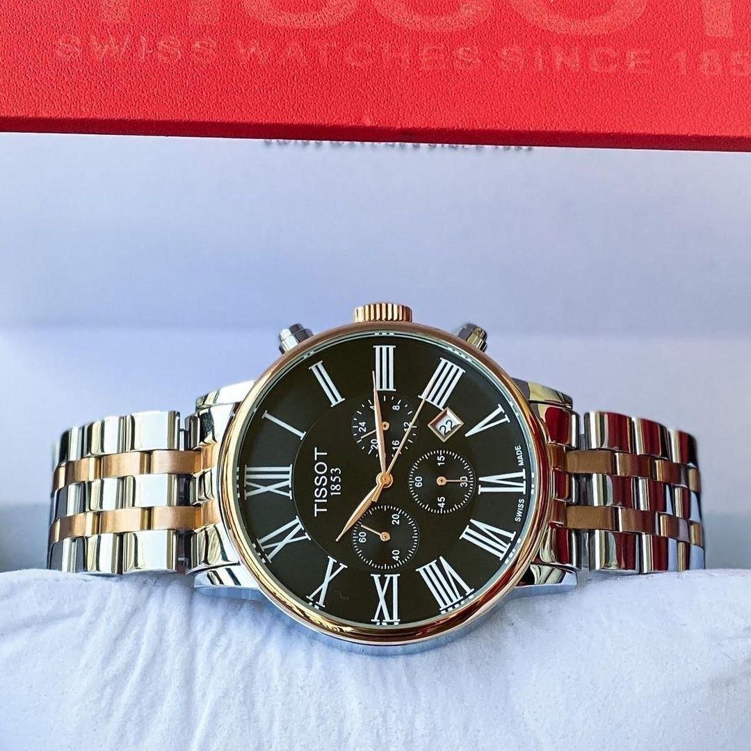 Tissot Carson Premium Chronograph — Two-Tone Rose Gold and Stainless Steel Case with Black Dial, Roman Numerals, Chronograph Sub-Dials, and Two-Tone Bracelet Hover