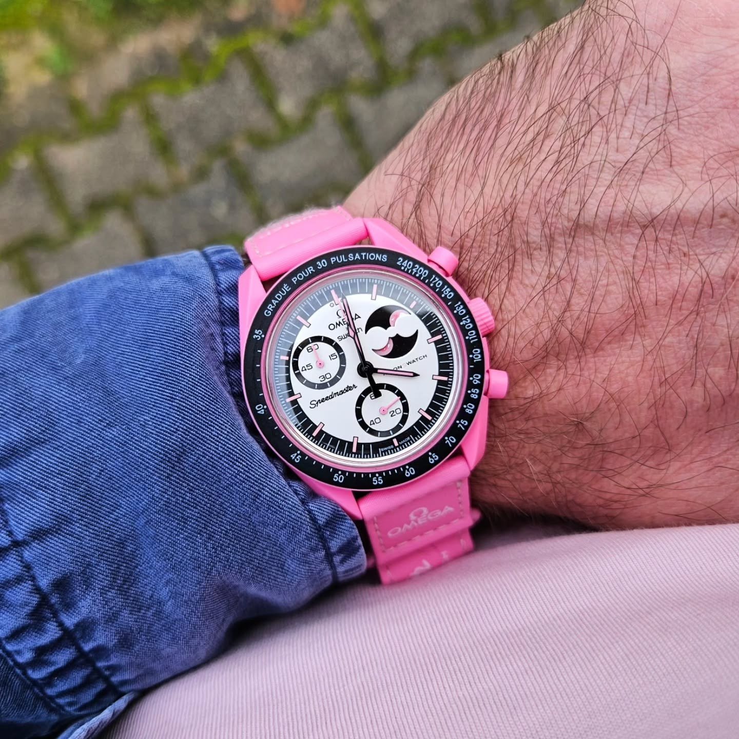 Omega x Swatch Bioceramic MoonSwatch "Mission to the Pink Moonphase" — Pink Bioceramic Case with Black and Silver-Pink Opaline Dial, Pulsometer Bezel, Moon Phase Indicator, and Pink Velcro Strap