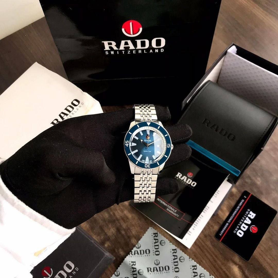 Rado Captain Cook Automatic — Stainless Steel Case with Blue Gradient Dial, Blue Ceramic Bezel, Date Display, and Multi-Row Steel Bracelet