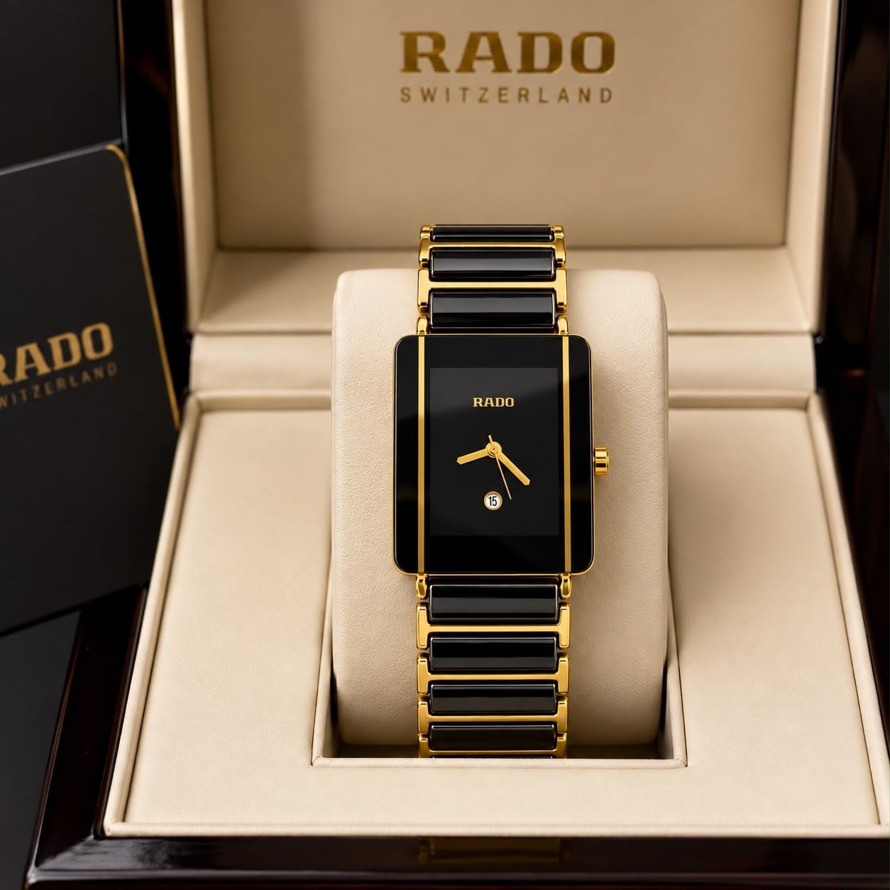 Rado Integral / Ceramica — Rectangular High-Tech Black Ceramic and Gold-Plated Case with Black Dial, Gold Hands, Date Window, and Matching Ceramic-Gold Link Bracelet