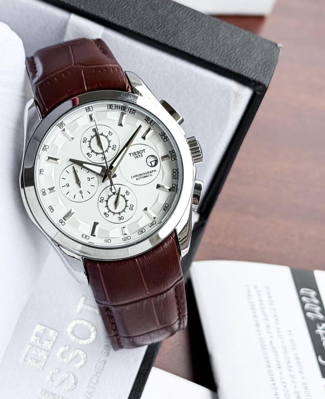 Tissot 1853 Chronograph Automatic — Stainless Steel Case with White Dial, Tachymeter Scale, and Brown Leather Strap