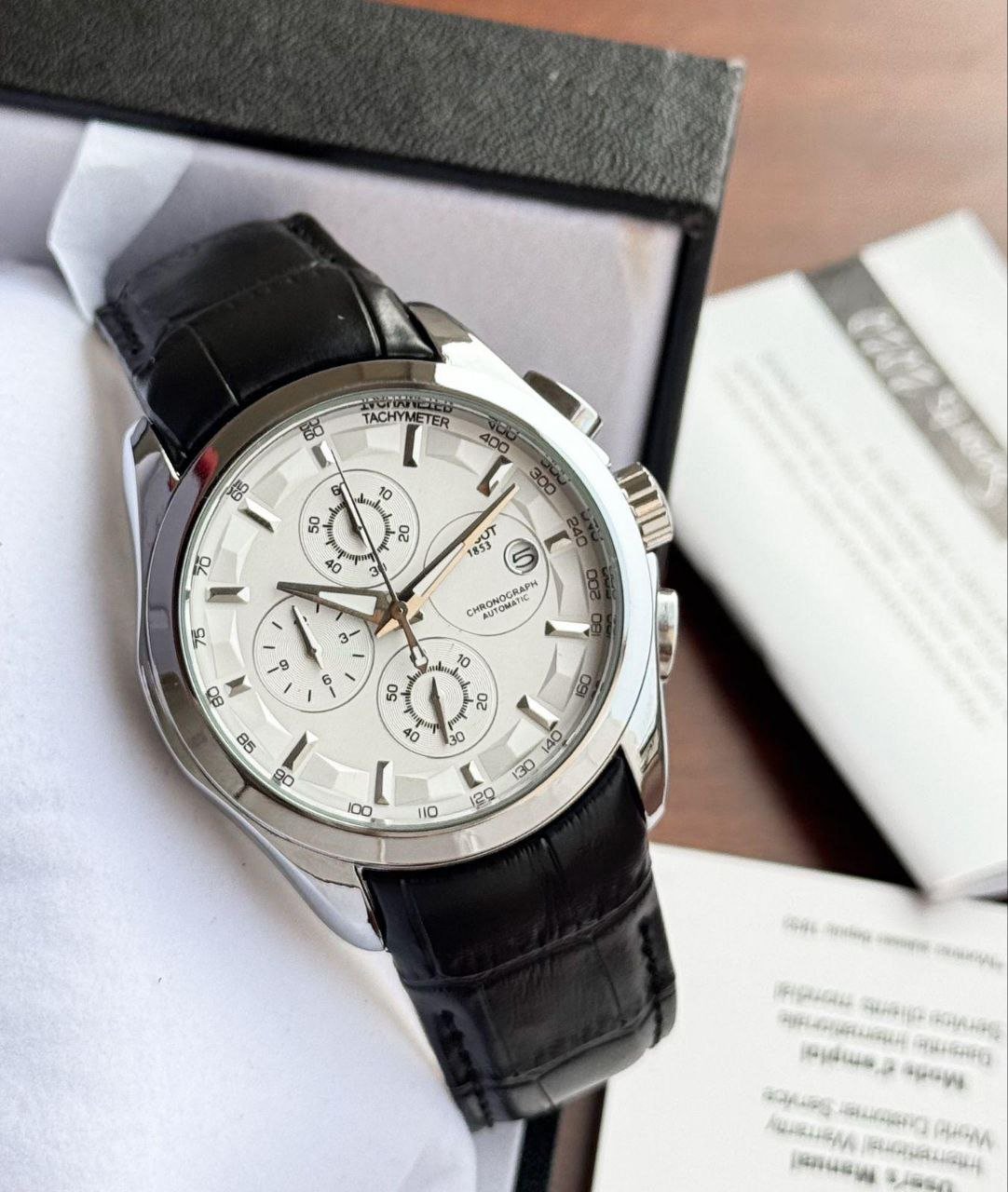 Tissot PR 100 Chronograph (White Dial Edition) — Stainless Steel Case with White Dial, Tachymeter Bezel, Chronograph Sub-Dials, and Black Leather Strap